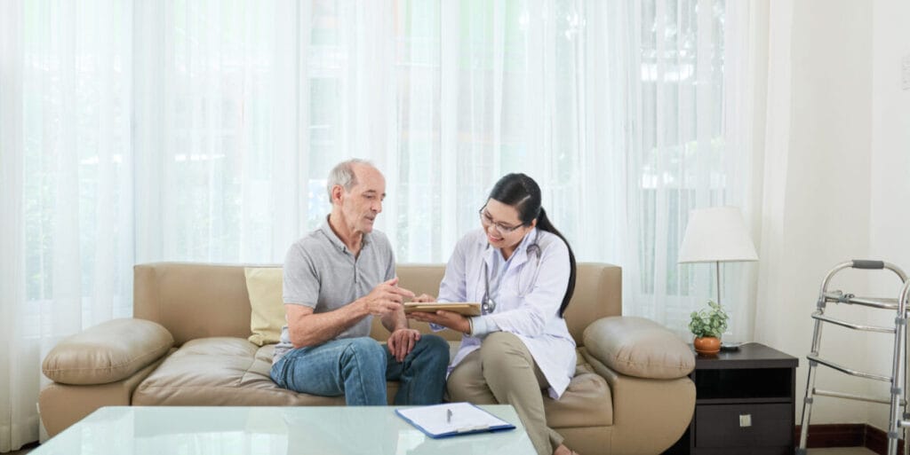 Professional doctor providing medical consultation at home in Sector 50 Noida